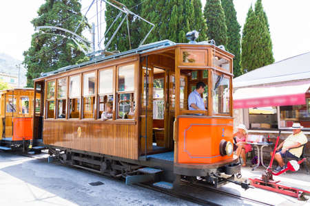 Historical railway with wooden carriages transports visitors to Soller port, Mallorca, Spain.の写真素材