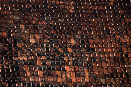 Roof with old weathered clay roof tiles repeat patternの写真素材