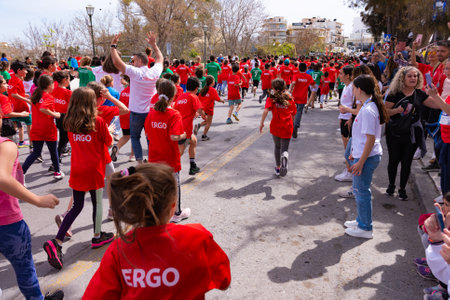HERAKLION, CRETE, GREECE, APRIL 2, 2023. School children runners athletes running at the annual Run Greece 1 km urban road race competition in Heraklion Crete Greece.のeditorial素材