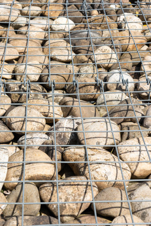 Galvanized gabion box filled with rocks. Nature park architecture landscapingの写真素材