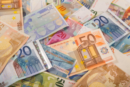 Currency mix Swiss francs and euro banknotesの写真素材