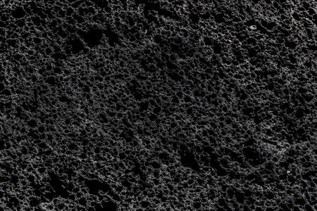 Volcanic rock relief structure lava background texture.の写真素材