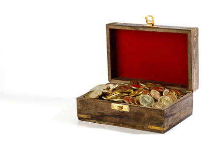 The coins are gilded in a wooden old chest with red velvet on the lid, isolated on a white background. Richの写真素材