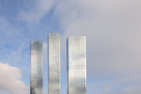 Modern skyscrapers against a background of blue sky with clouds in the business center of Moscow City.の写真素材