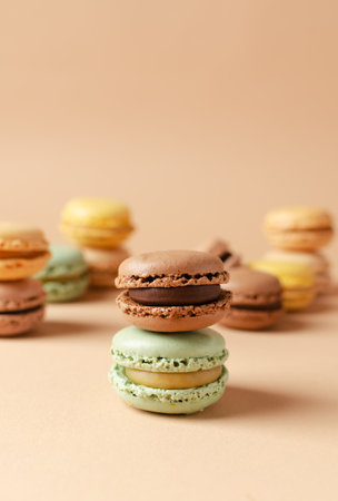 Pastel shades french macarons or macaroons (almond cookies) on the background. Copy space for text