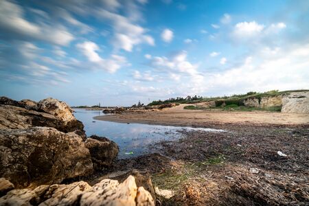 Shot of the Cirica Bay at sunrise. Cirica is a beautiful natual seaside place made of cliffs, rocks and sand in the southern Sicily, Italyの写真素材