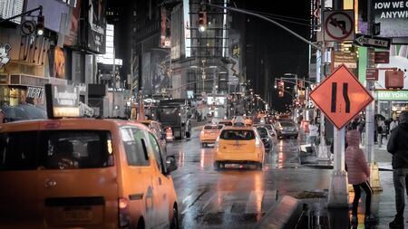 New York City, Usa - April 23, 2019: Shot of Times Square at night with cars and cab driving in Broadwayのeditorial素材