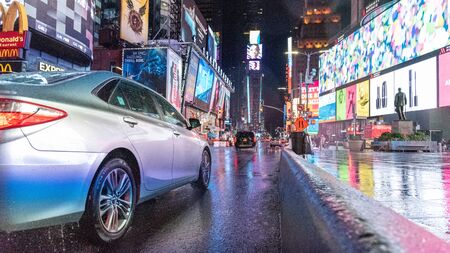 New York City, Usa - April 23, 2019: Shot of Times Square at night with cars and cab driving in Broadwayのeditorial素材