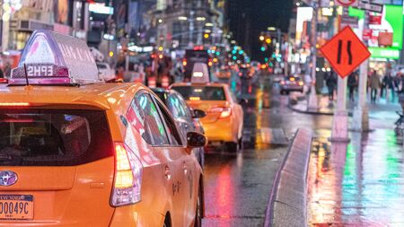New York City, Usa - April 23, 2019: Shot of Times Square at night with cars and cab driving in...