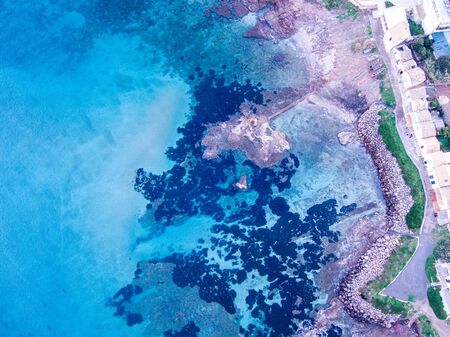 Wondeful aerial view at sunset of the coastline of Portopalo, a town in the south of Sicily. The shot is taken during a beautiful sunny dayの写真素材