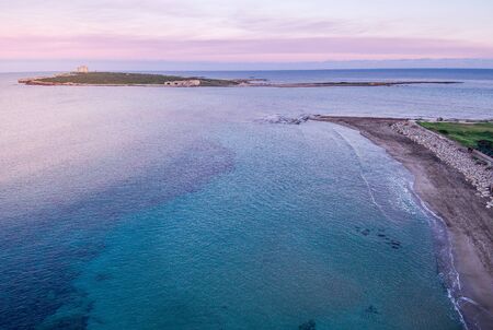 Wondeful aerial view at sunset of the island in front of Portopalo, a town in the south of Sicily. The shot is taken during a beautiful sunny dayの写真素材