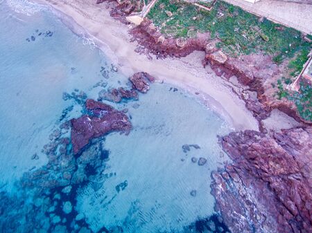 Wondeful aerial view at sunset of the coastline of Portopalo, a town in the south of Sicily. The shot is taken during a beautiful sunny dayの写真素材