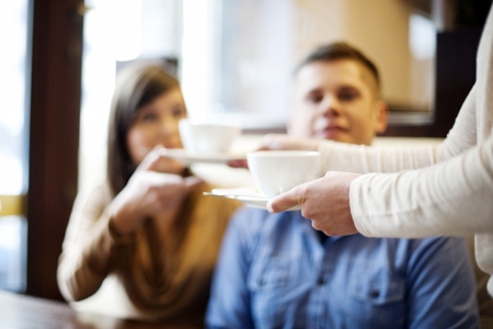 Young couple in restaurantの写真素材