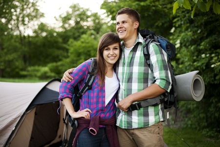 Young couple standing in front of tentの写真素材