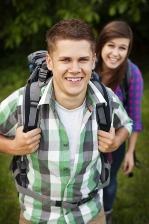 Young couple walking through forestの写真素材