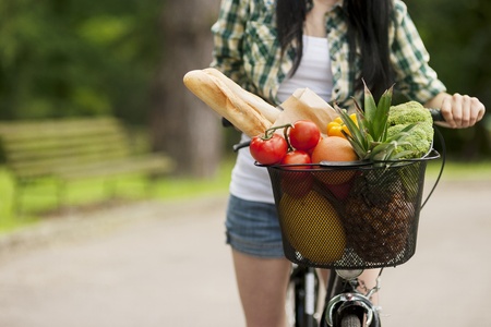 Basket filled fruits and vegetablesの写真素材