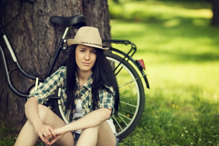 Beautiful young woman resting in parkの写真素材