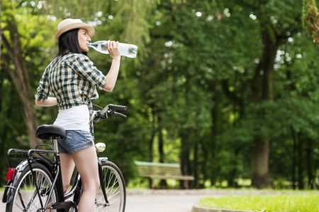 Cyclist drinking mineral waterの写真素材