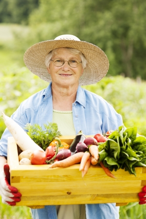 Senior woman with vegetablesの写真素材