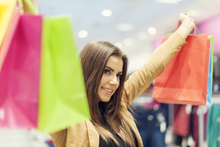 Satisfied woman with shopping bagsの写真素材
