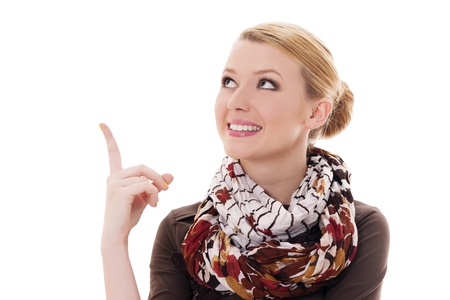 Young blonde woman pointing upの写真素材
