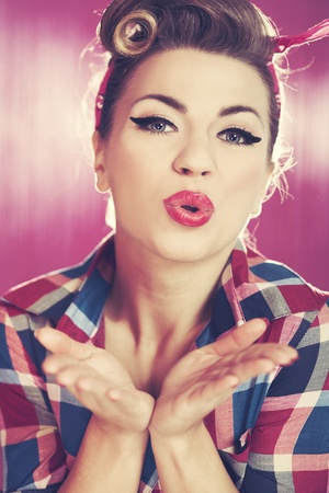 Pin-up girl blowing a kissの写真素材