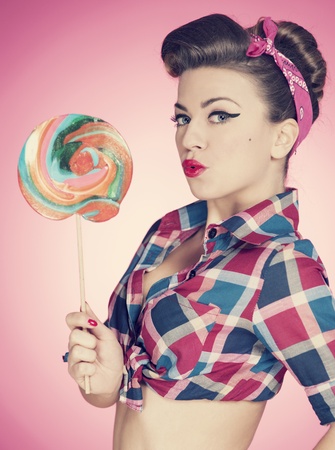 Retro sexy woman with large lollipopの写真素材