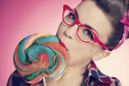 Pin up girl eating lollipopの写真素材