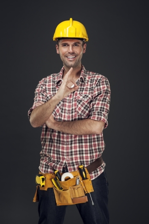 Cheerful construction worker showing OK signの写真素材