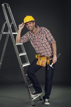 Manual worker leaning on the ladderの写真素材