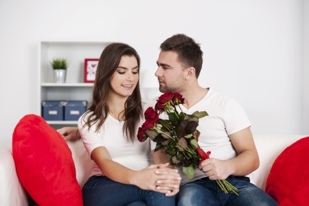 Loving couple with red rosesの写真素材