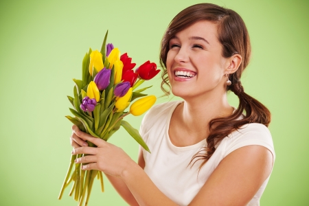 Laughing woman with tulipsの写真素材