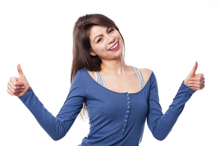 Young woman with thumbs upの写真素材