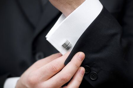 Cuff link, man is getting dressed