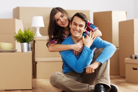 Portrait of happy couple in new home の写真素材
