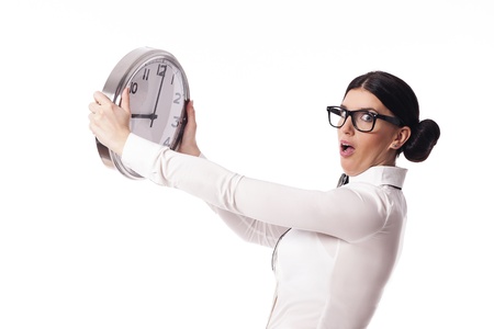 Shocked woman holding a office clockの写真素材