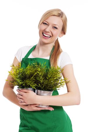 Happy gardener female with her plantsの写真素材