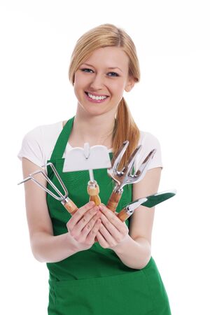 Happy young woman with gardening equipment の写真素材