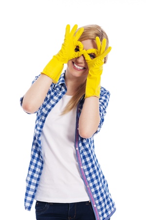 Cheerful woman with protective glove making hand gestureの写真素材