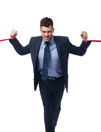 Angry businessman trying to release の写真素材