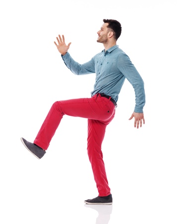 Young man stepping up for successの写真素材
