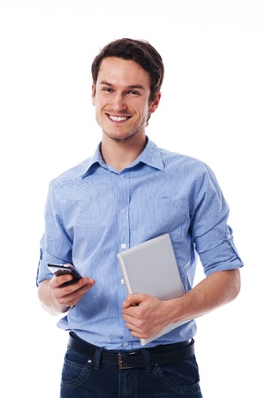 Happy man holding mobile phone and digital tabletの写真素材