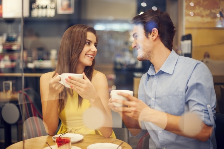 Two people in cafe enjoying the time spending with each otherの写真素材