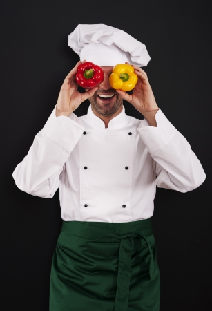 Funny chef covering his eyes of paprikaの写真素材