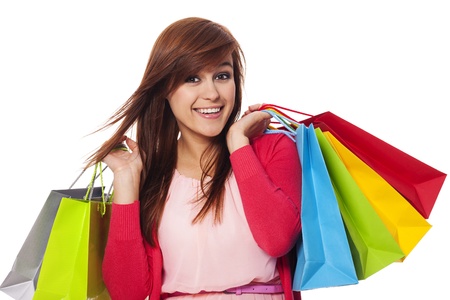 Smiling woman holding shopping bagsの写真素材