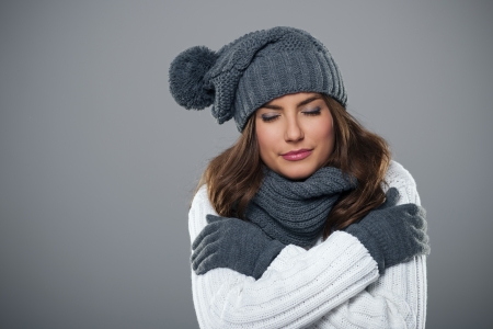 Young woman shivering during the winter season の写真素材