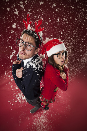 Freezing nerd couple during the snowing の写真素材