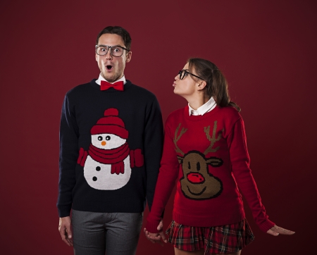 Nerdy woman kissing shocked man の写真素材