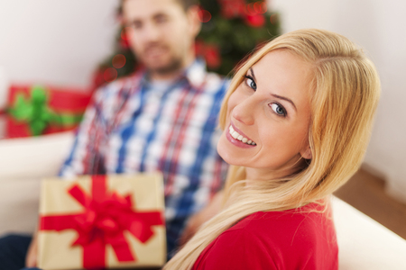 Happy couple celebrating christmas time の写真素材