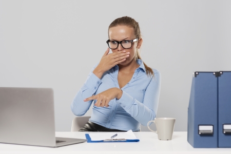 Shocked woman pointing at laptop 
の写真素材